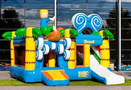 Springkasteel in thema strand met een glijbaan kopen voor kinderen. Bestel opblaasbare springkastelen online bij JB Inflatables Nederland