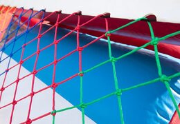 Springkussen in brandweer auto thema met glijbaan en leuke objecten op het springvlak bestellen voor kinderen.  Koop opblaasbare springkussens online bij JB Inflatables Nederland