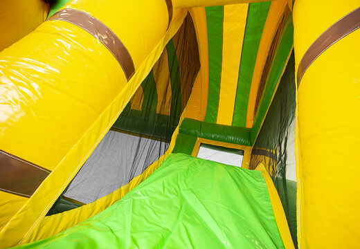 Springkussen in thema jungleworld met een glijbaan kopen voor kinderen. Bestel opblaasbare springkussens online bij JB Inflatables Nederland