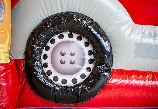 Groot opblaasbaar overdekt brandweer multiplay springkussen met glijbaan bestellen in lego thema voor kids. Koop springkussens online bij JB Inflatables Nederland